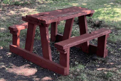 A traditional picnic bench restored as part of volunteer-led improvements at Sling Playing Fields.