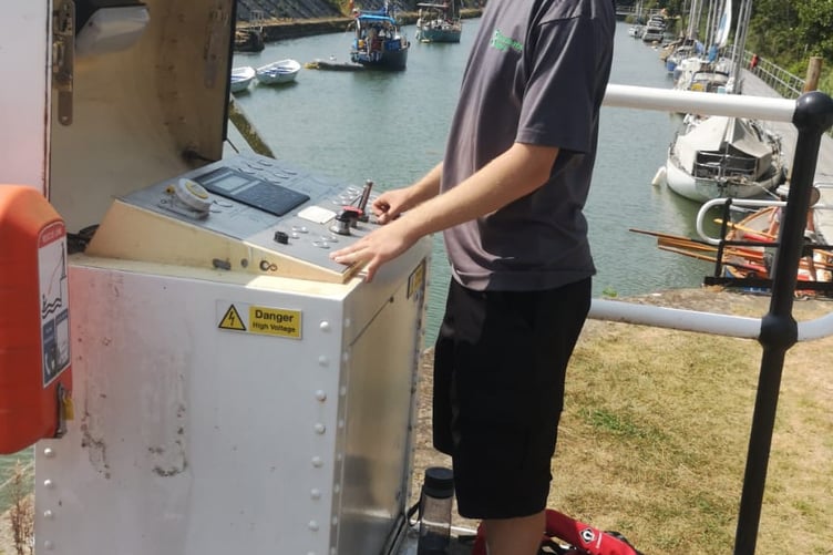 Assistant Harbour Master Toby Harris from the Environment Agency operates the lock gates.