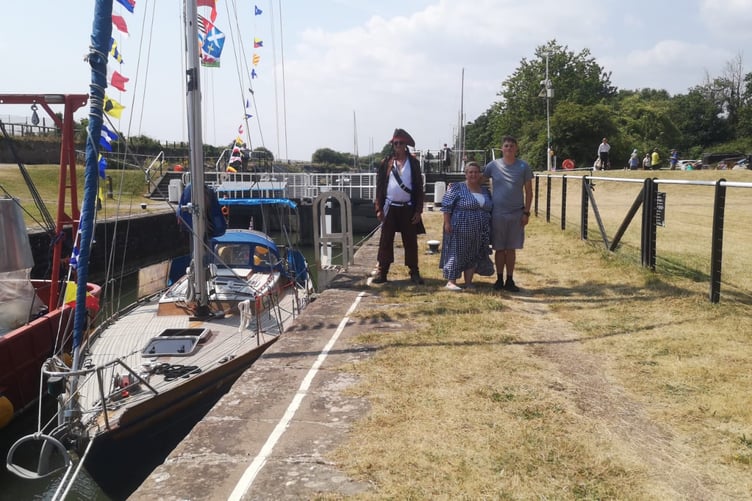 'Pirate' Ade Borrelli (left) and Orion Hathaway (right) show Mayor Tasha Saunders Ade's 'best dressed boat', Cyanne.