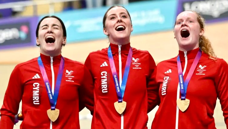 Lowri Thomas, Emma Finnucane and Rhian Edmunds belt out the Welsh anthem. Photo: Team Wales