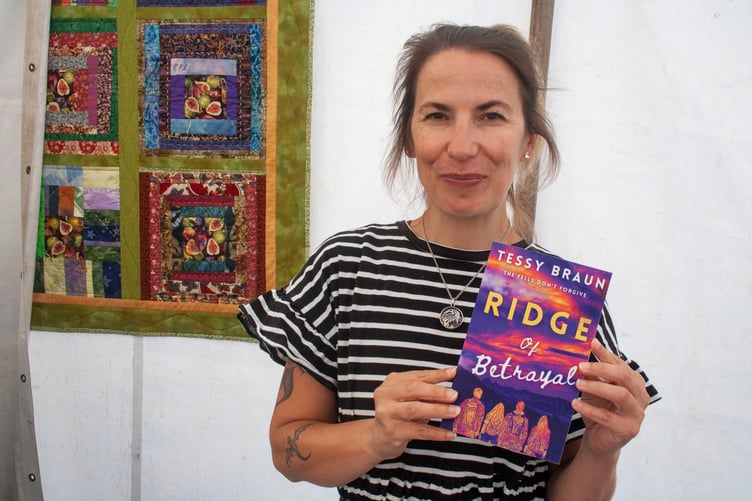 Tessy Braun with her novel Ridge of Betrayal.