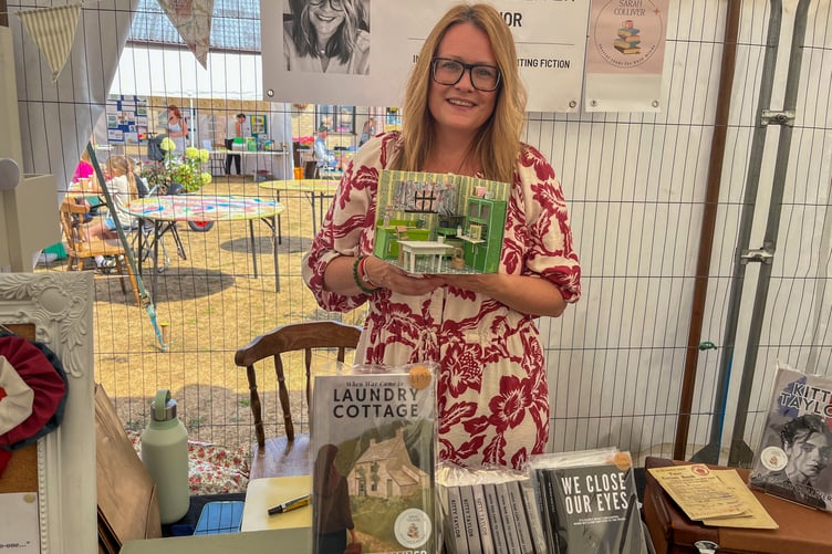 Ruardean author Sarah Colliver with a model of the kitchen in her novel Laundry Cottage which was made by one of her readers.