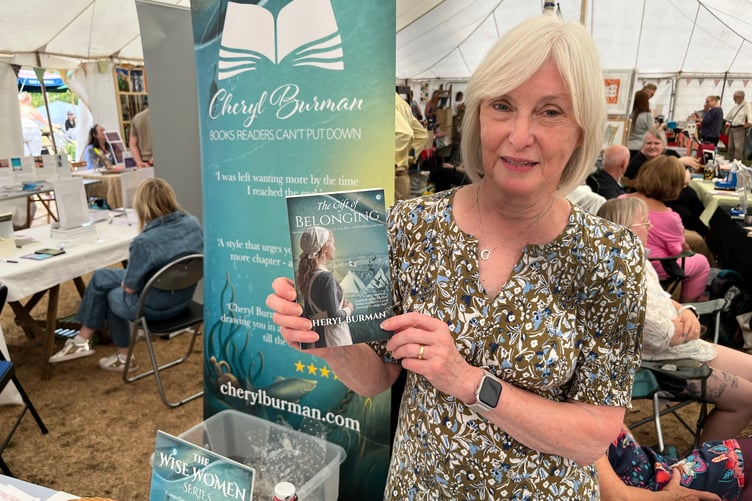 Cheryl Berman of Lydney with her lateest novel The Gift of Belonging.