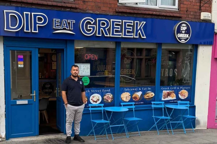 Aris Priftis outside his Dip Eat Greek restaurant in Moor Street, Chepstow. Council planners have refused permission to keep the LED illuminated sign.
