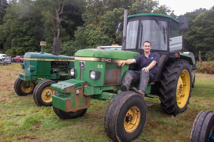 Liam James of Allaston with a John Deere 2140 tractor.
