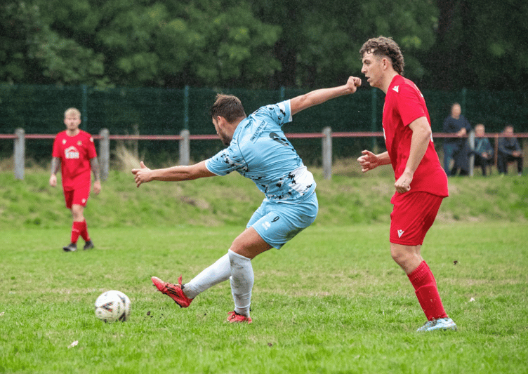 A Monmouth player tries a shot against Abertillery Excelsiors