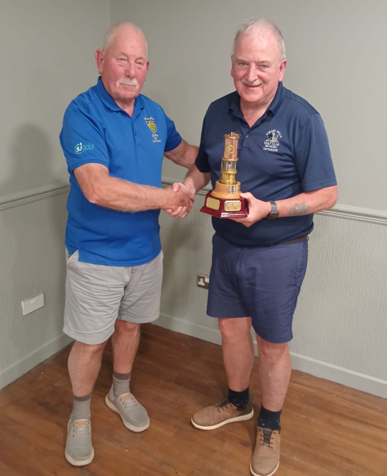 Dave Donoghue presents the Miners Lamp Trophy to Forest Hills captain Kev Doyle.